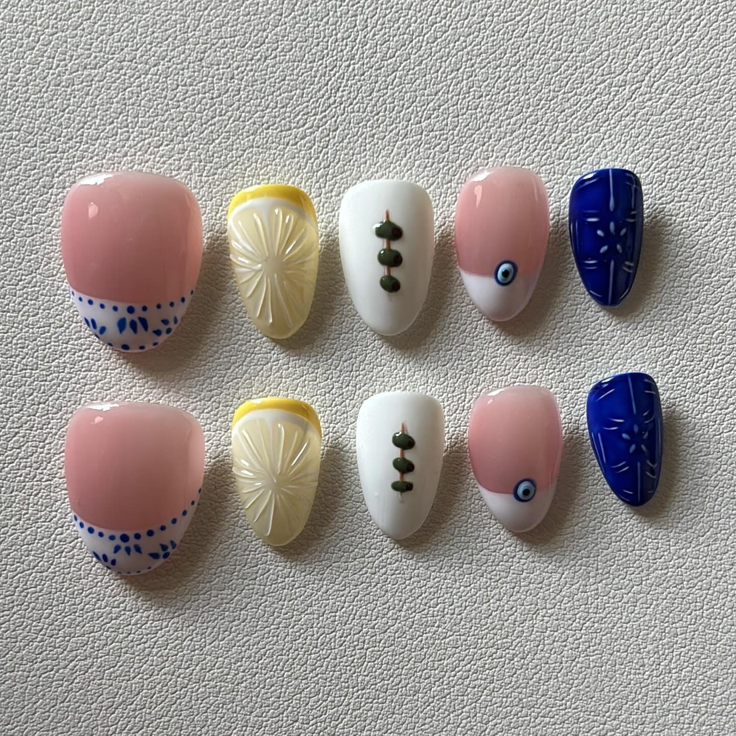 Olives, blue ceramic tile, lemons, Greek summer! 

Products used; 
Xxxs almond gel tips
@mpa_onlinestore MPA Pallet
@dndgel mastermind, marine jelly, perfect white