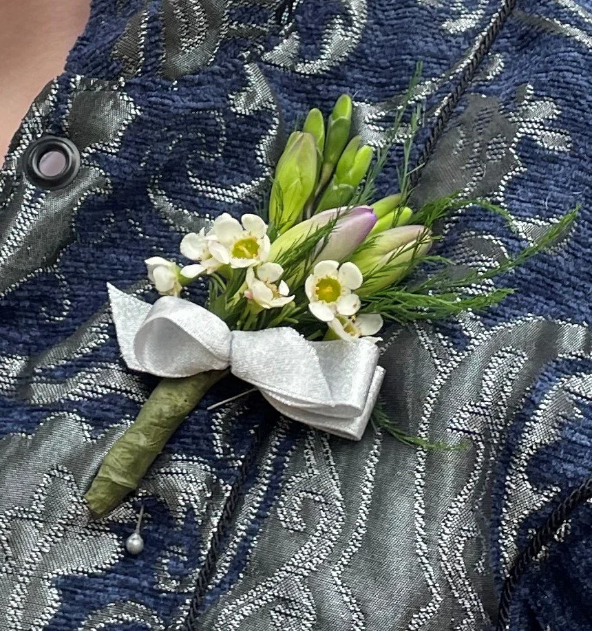 Specialty Boutonniere with Freesia, Wax Flower and Tree Fern