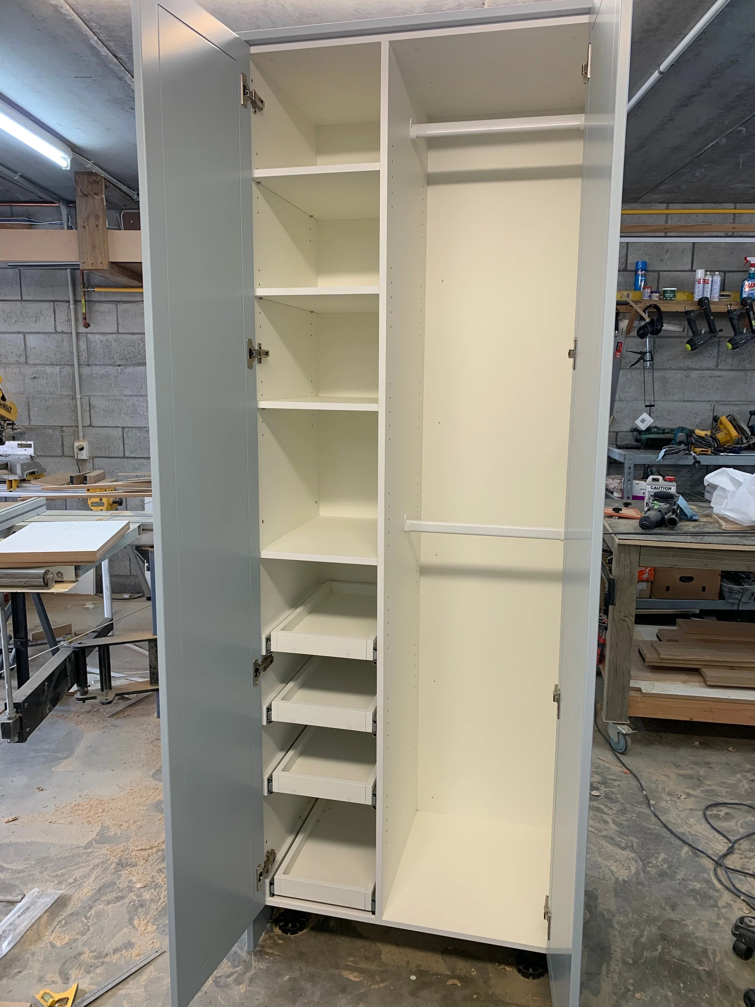 Open view of free standing wardrobe in workshop 