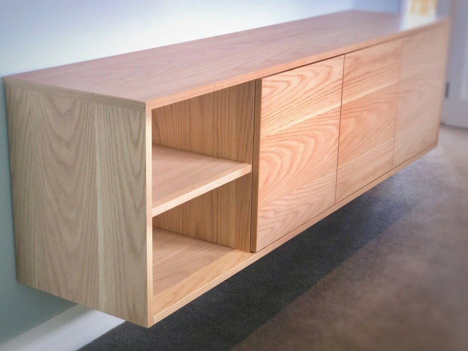 American white oak wall hung entertainment unit with three cabinets and two shelves