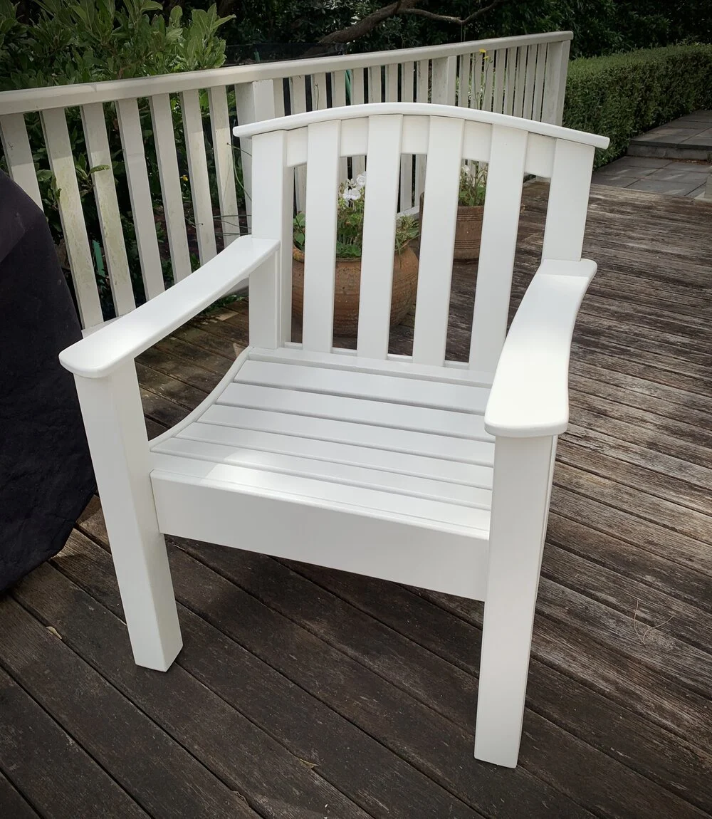White wooden deck chair on deck