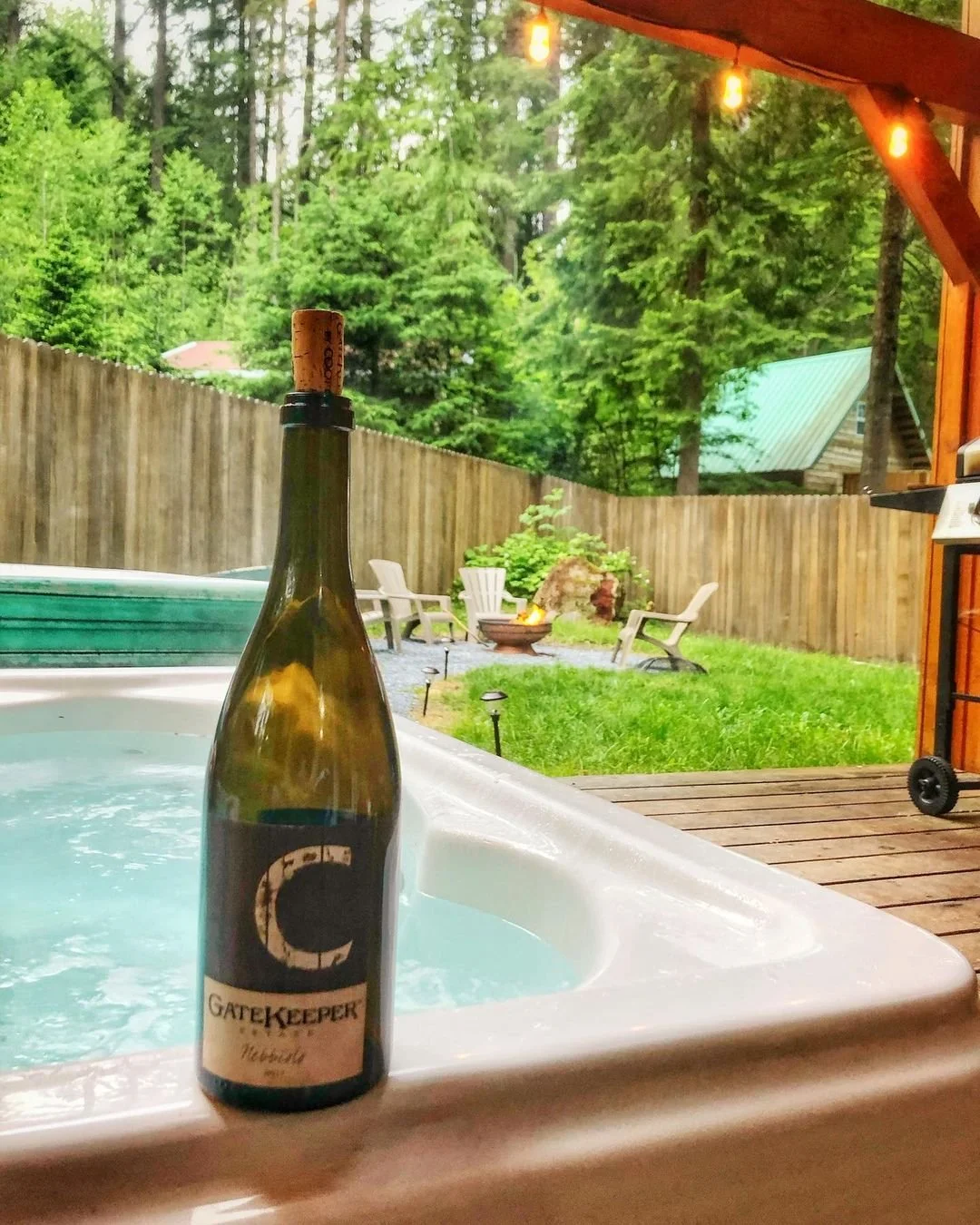 Bottle of Cooper Wine in front of a jacuzzi 