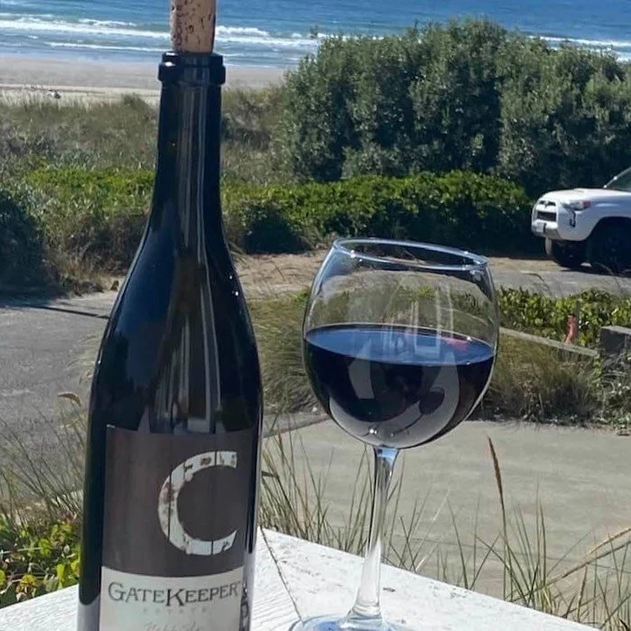 Bottle and glass of Cooper Wine at the ocean