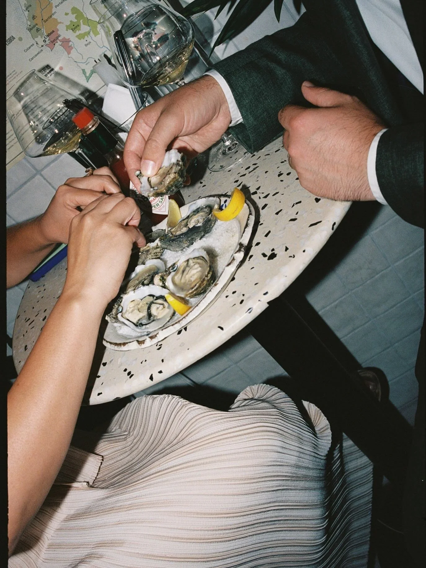 A beautiful elopement in Lisbon that ended with champagne and oysters (as well as a cheesecake that they ordered just to amuse me) at a tiny wine bar in Cascais. We were the only customers and the bartender came to our table to chat. Elopements are s