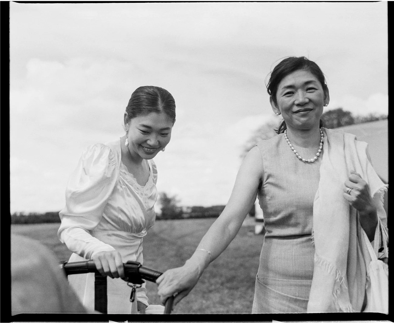 Bride sharing a spontaneous, candid moment with her mother during the wedding in Lisbon captured on film.