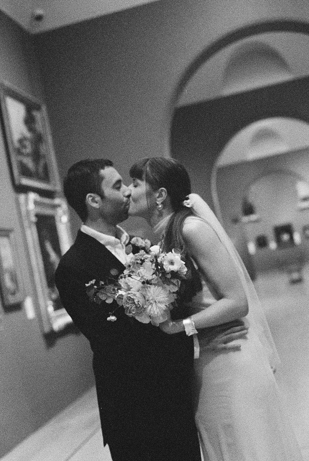 Bride and groom kiss at Dulwich Picture Gallery wedding