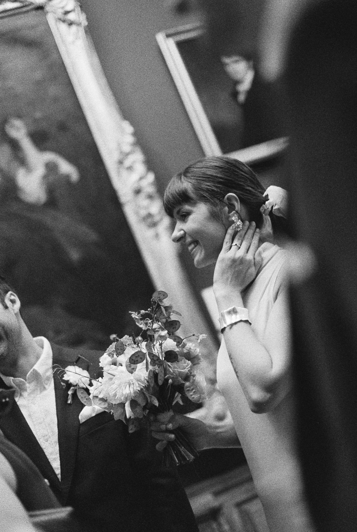 Bride smiling on BW film during wedding ceremony at Dulwich Picture Gallery.