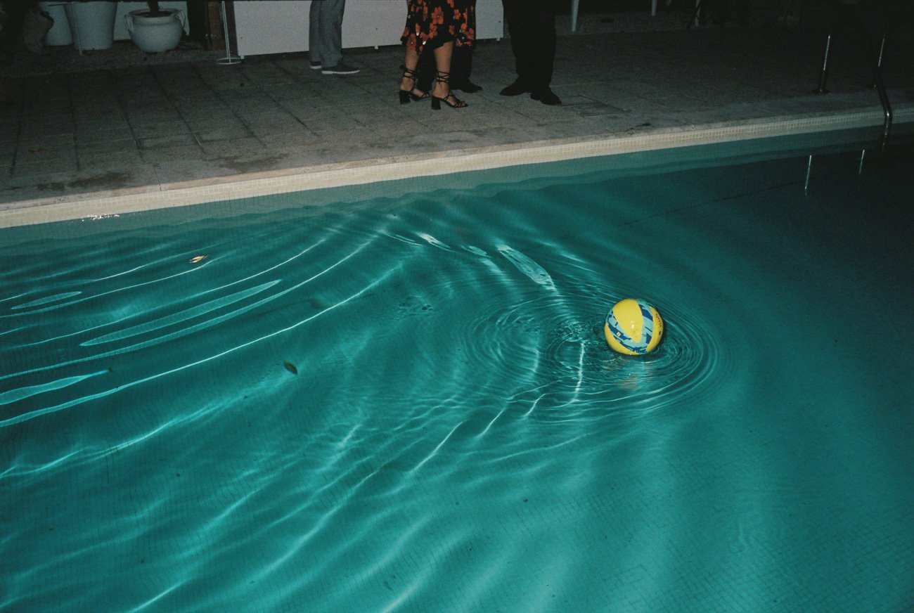 detail of the pool at night after the wedding party by Algarve film wedding photographer