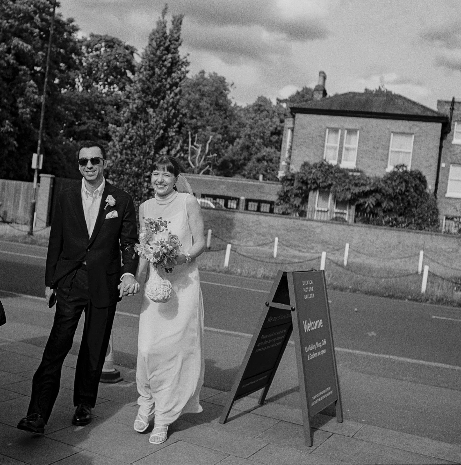 Bride and groom portrait entering Dulwich Picture Gallery wedding