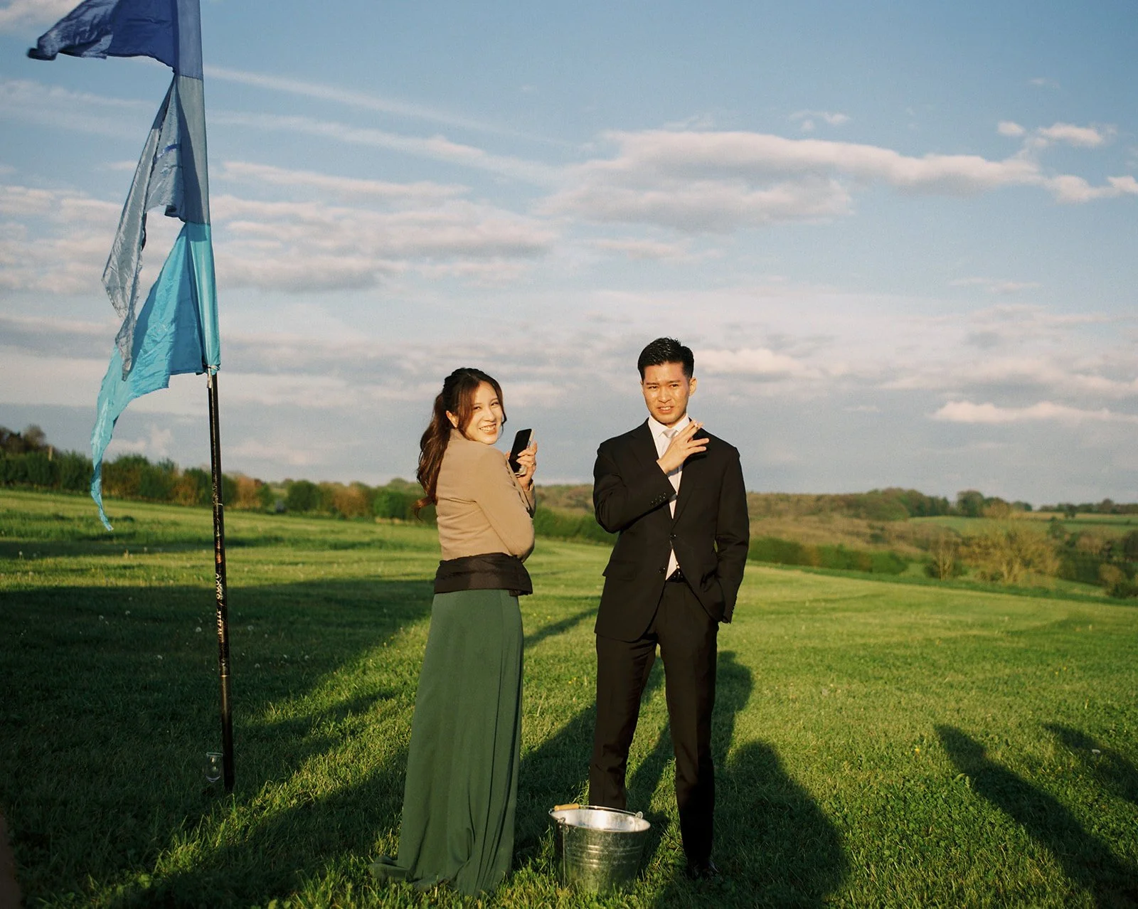 Guests pose on a sunny day at a Montpellier wedding venue.