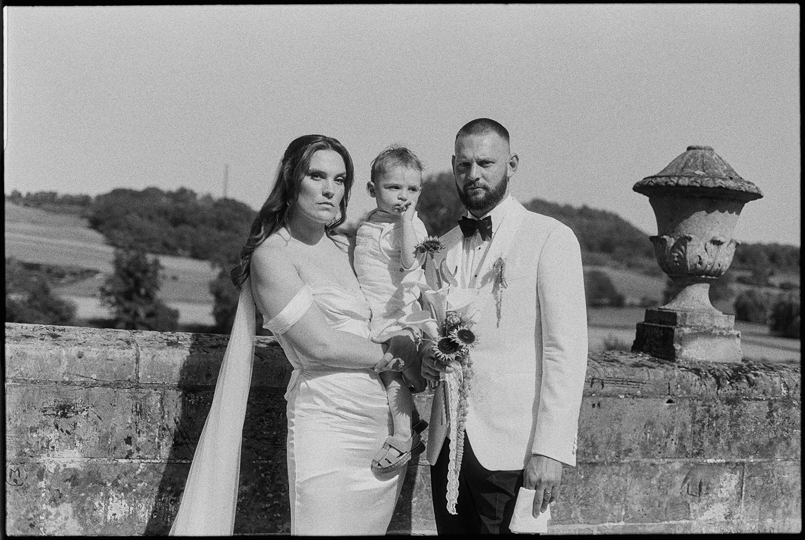 Bride, groom and son portait at Chateau Neercanne wedding