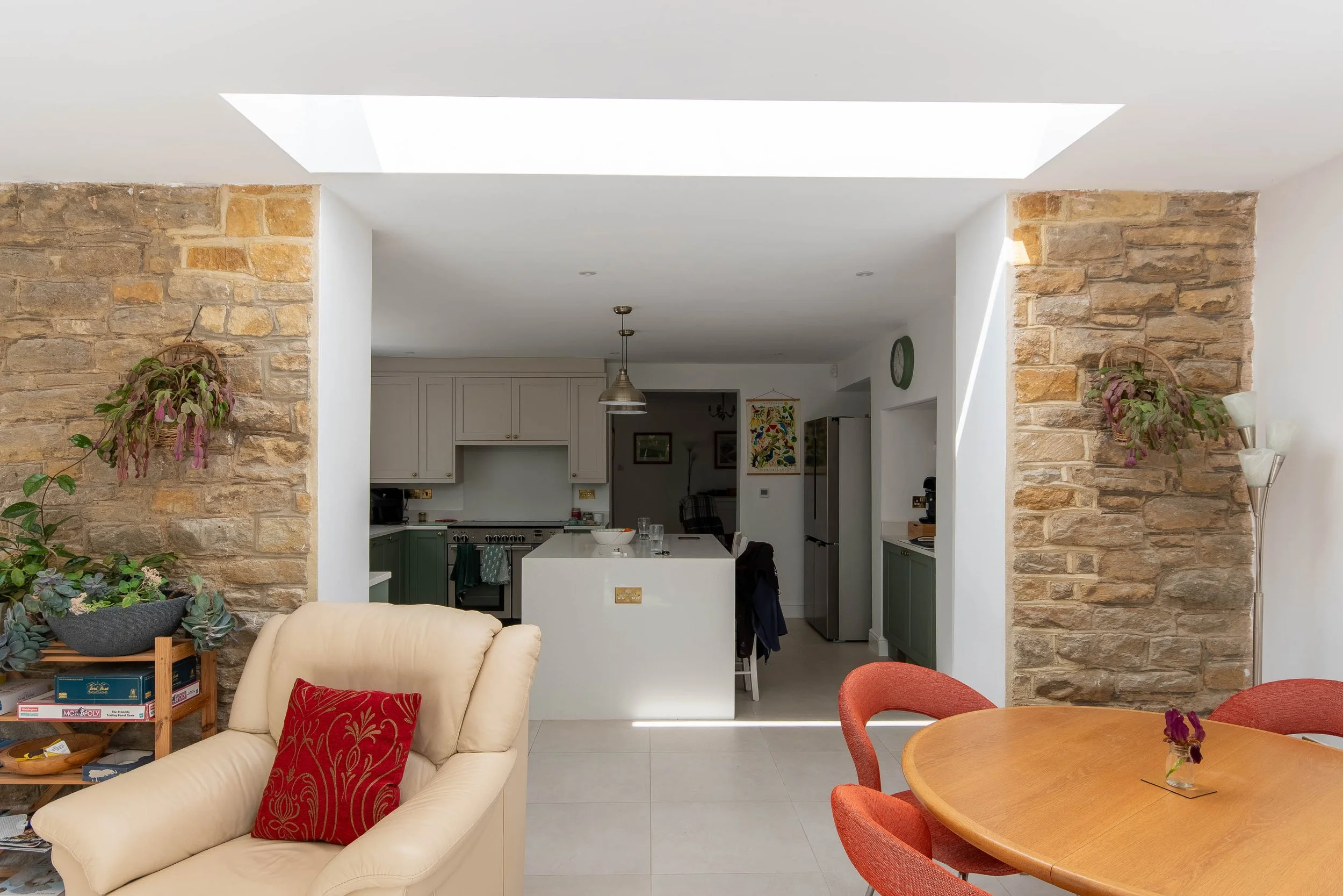 The modern open-plan extension connects directly to a new kitchen area.