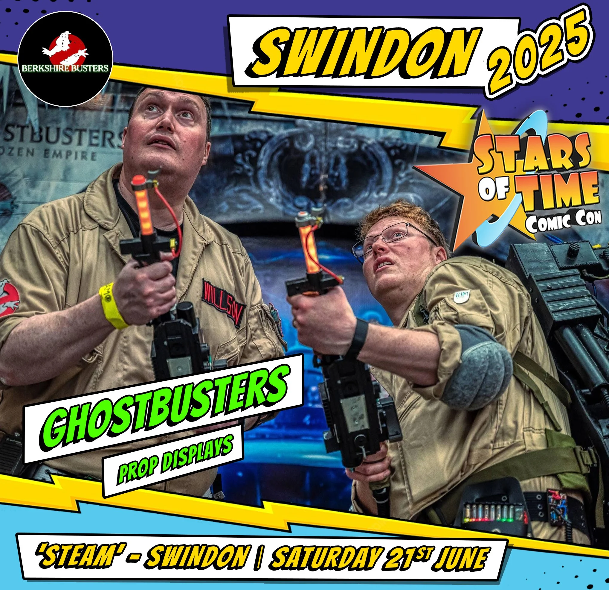Two men dressed as Ghostbusters holding proton pack props at Swindon comic con, with a backdrop of a Ghostbusters themed display and promotional banners for the event, including dates and the comic con logo.