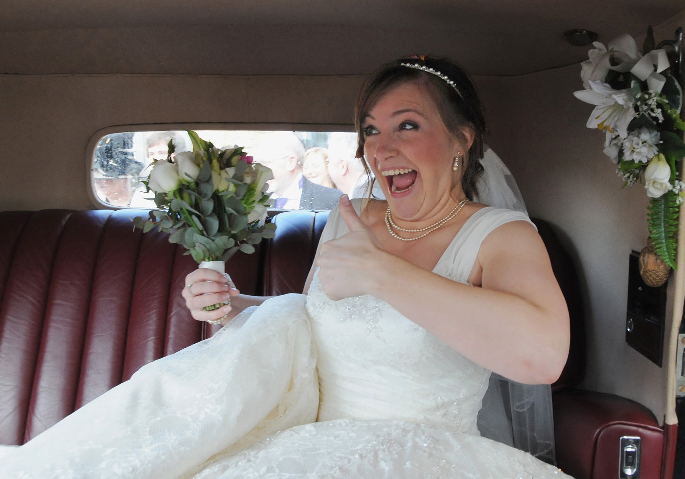 A bride's excited arrival at her wedding.