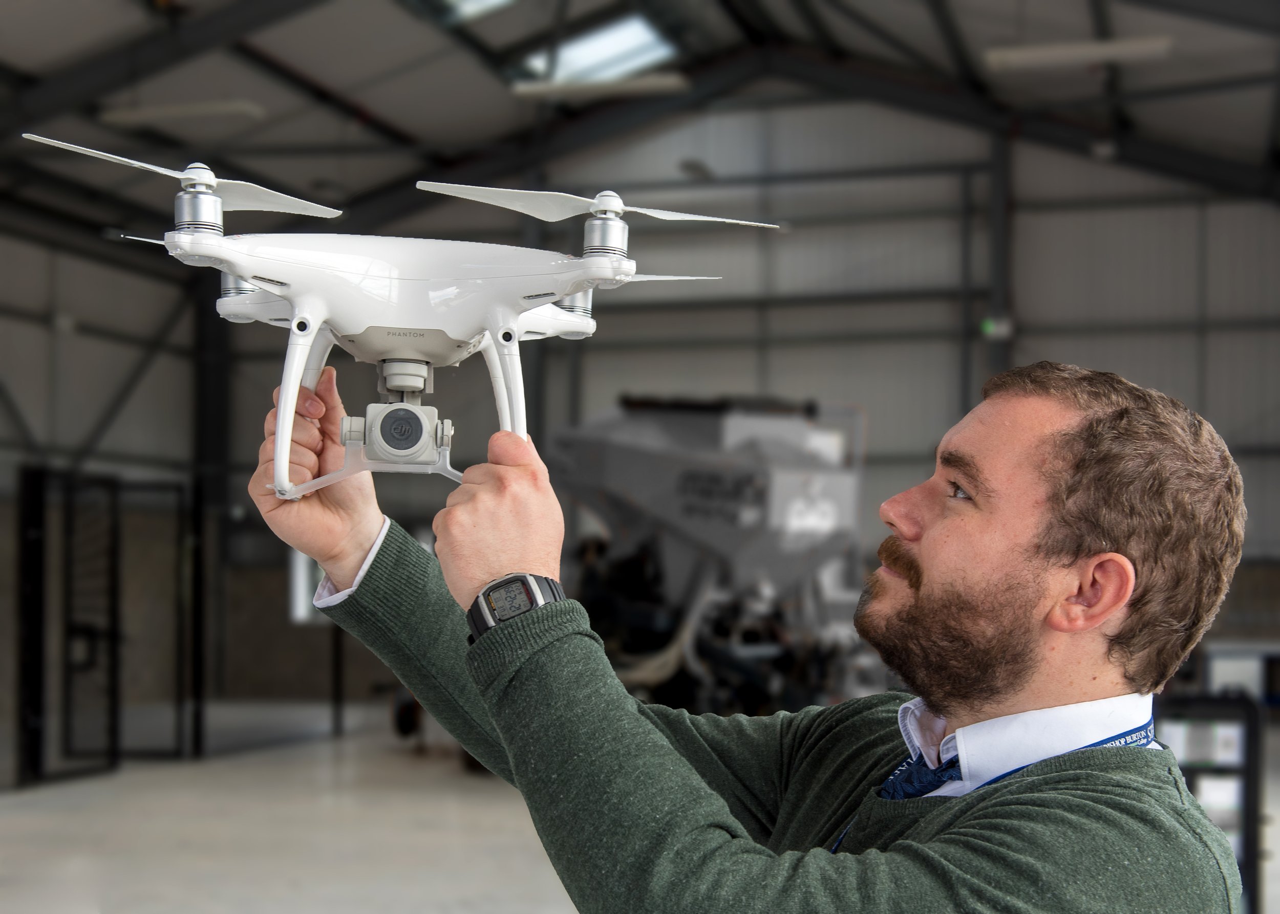 Man hold aloft a drone