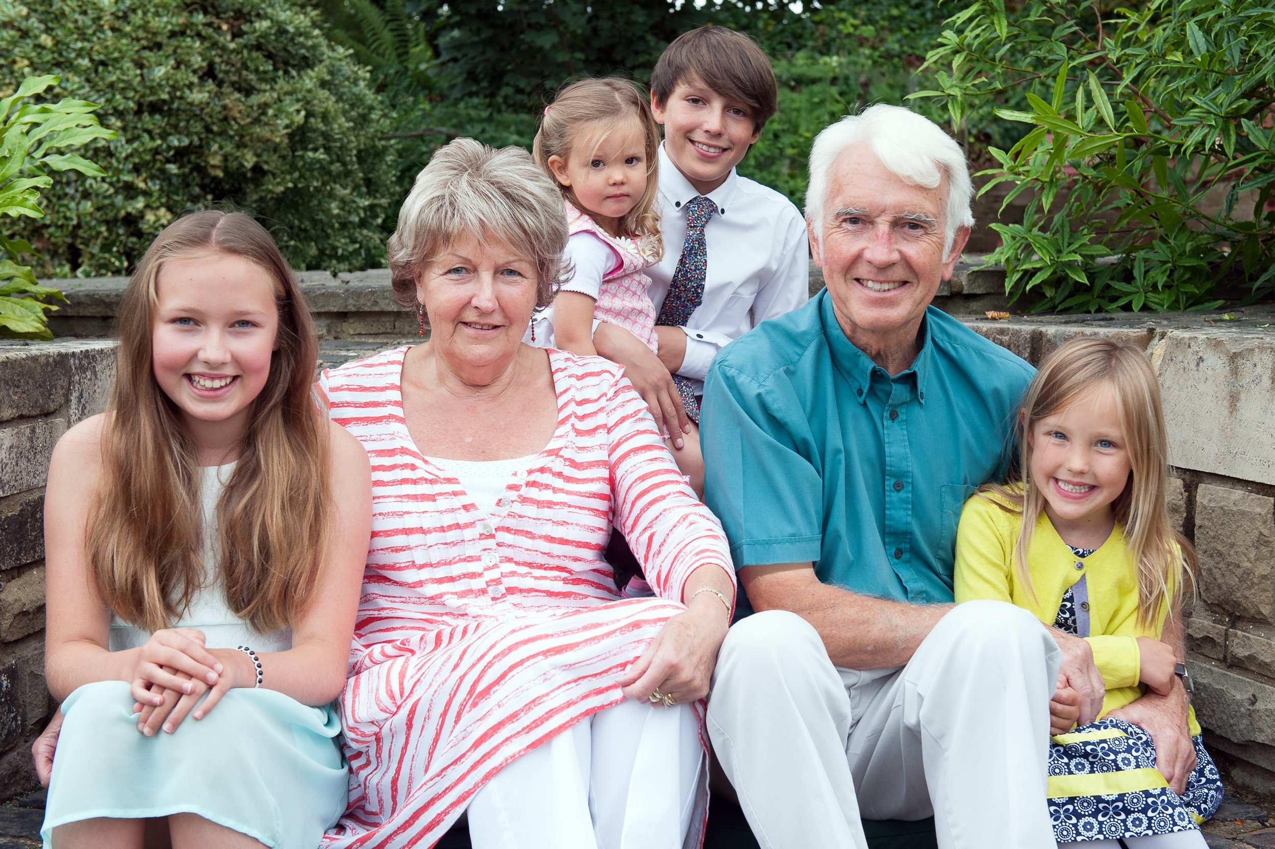 Beautiful multi-generational family portrait capturing love, connection and cherished moments. Timeless family photography in natural outdoor settings.