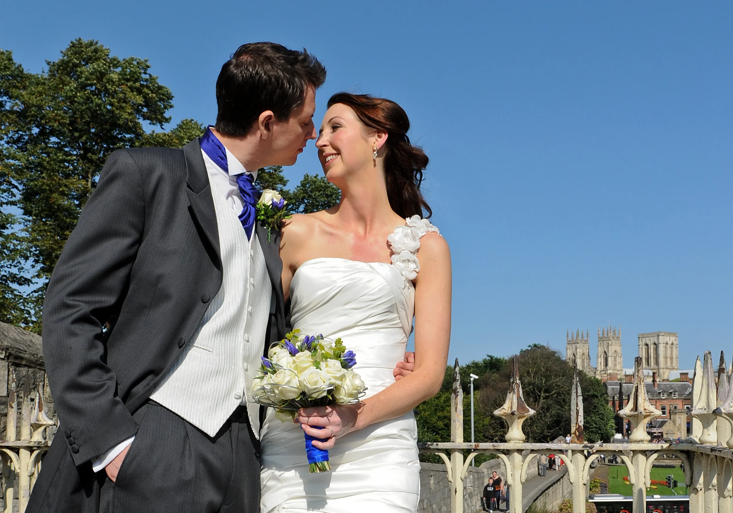 Wedding couple pictured on York city walls with York Minster in the background