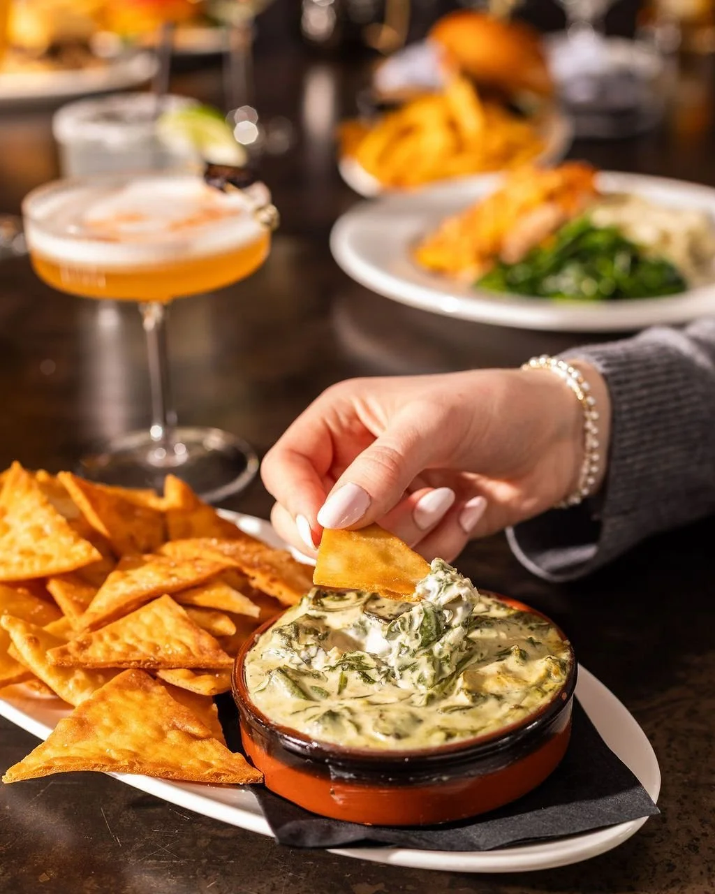 Creamy, cheesy, and perfectly shareable. Our spinach artichoke dip is the kind of starter that makes happy hour even happier. Grab your crew and dig in. 🧀🍃✨

Happy Hour: Sunday - Thursday | 5pm to 7pm
Spinach Artichoke Dip: All day, every day