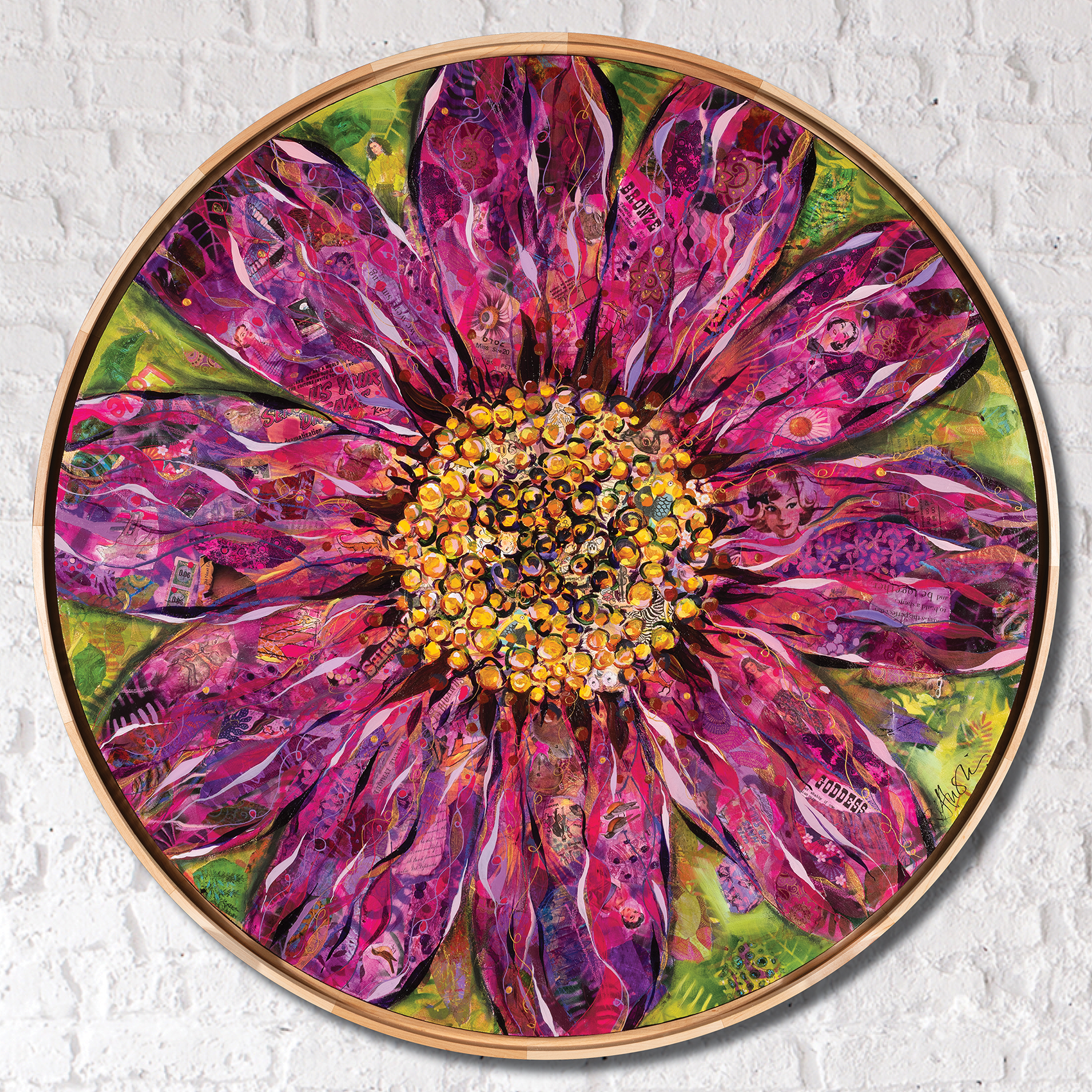 Mixed media collage painting of a vibrant pink and magenta flower with a golden yellow center, displayed in a round wooden frame