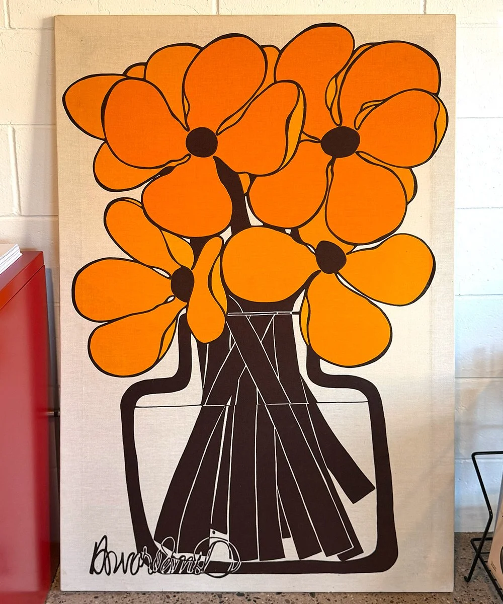 Original Vintage Mid-Century Modern floral artwork featuring bold orange flowers in a graphic brown vase, available at Design Culture GR in Grand Rapids, Michigan.