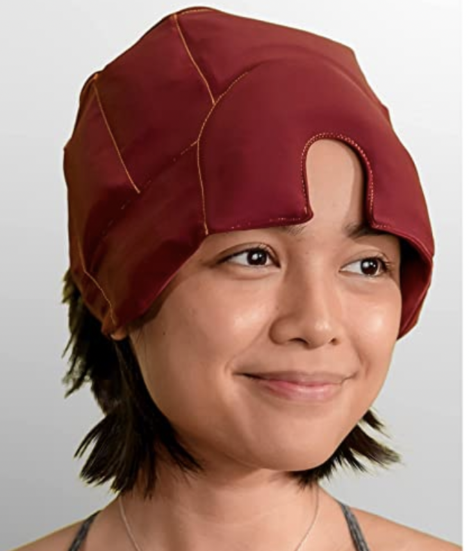 Woman wearing Medcosa Migraine hat