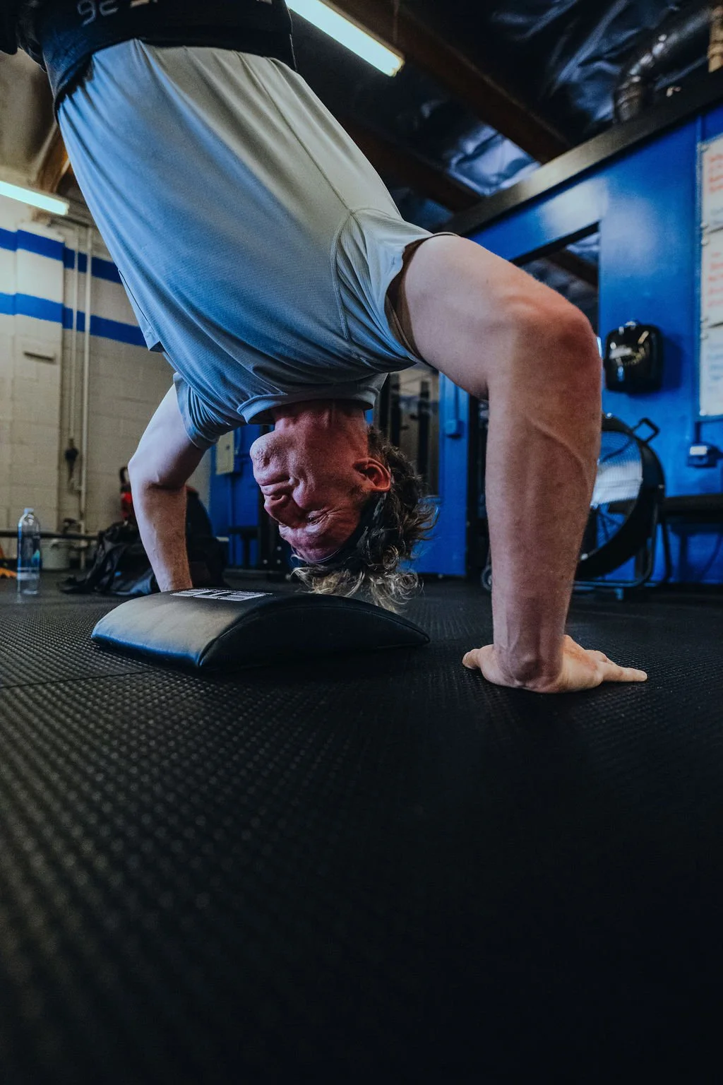 4 SETS FOR TIME 
3 Wall Walks 
8 Handstand Push-Ups 
12 Alt. Hang DB Snatches (50/35) 
20/16 Cal Bike

-Rest 2:00 b/t Sets-

TIPS: Push each round hard without worrying about pacing. While these sets aren&rsquo;t an all-out sprint, you should be work