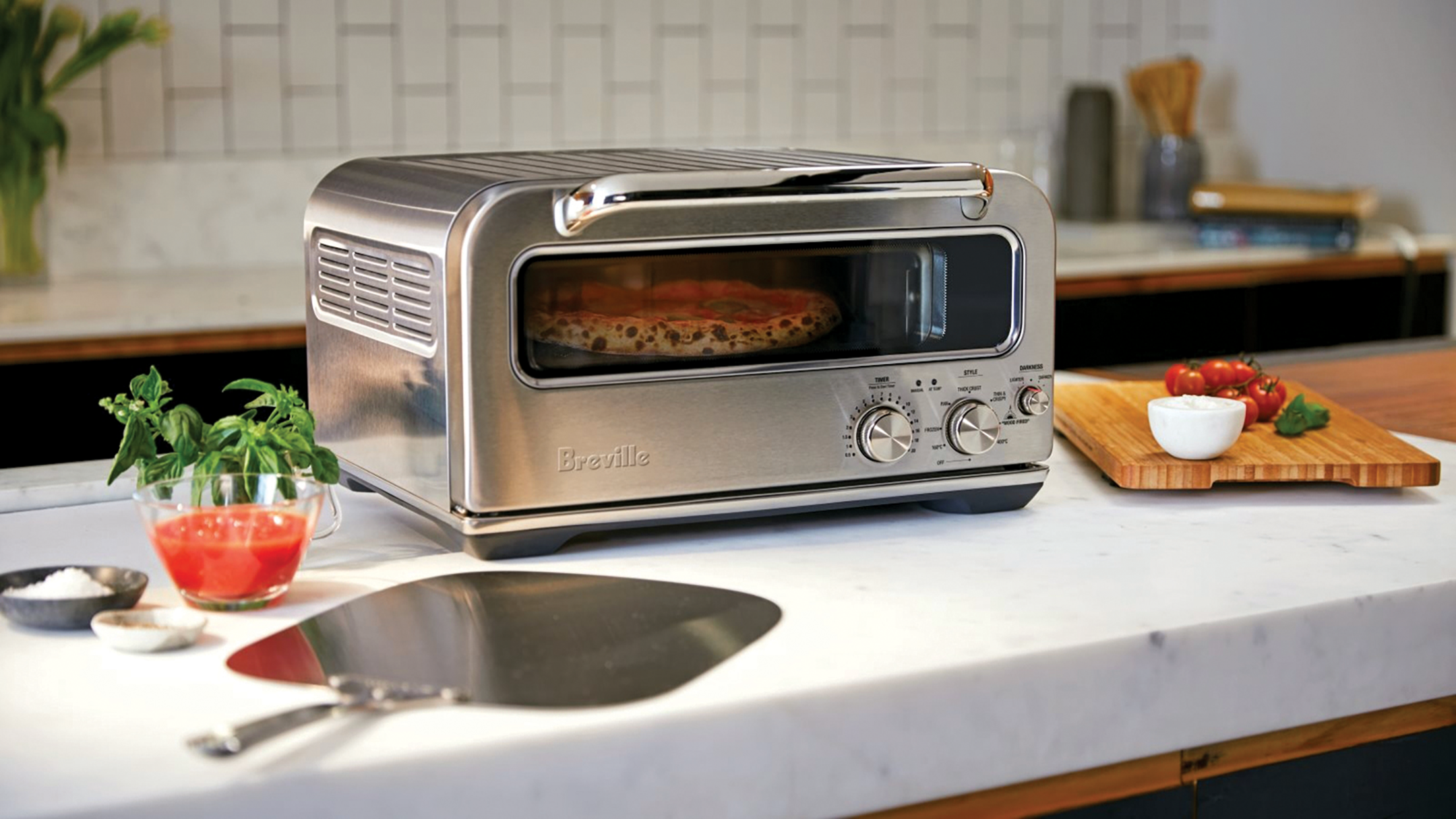  Say ciao to the  Pizzaiolo  by Breville, the first domestic countertop oven to hit 750°F, that cooks authentic wood-fired style pizzas in two minutes. Replicating the three types of heat generated by a brick oven – conductive, radiant and convective