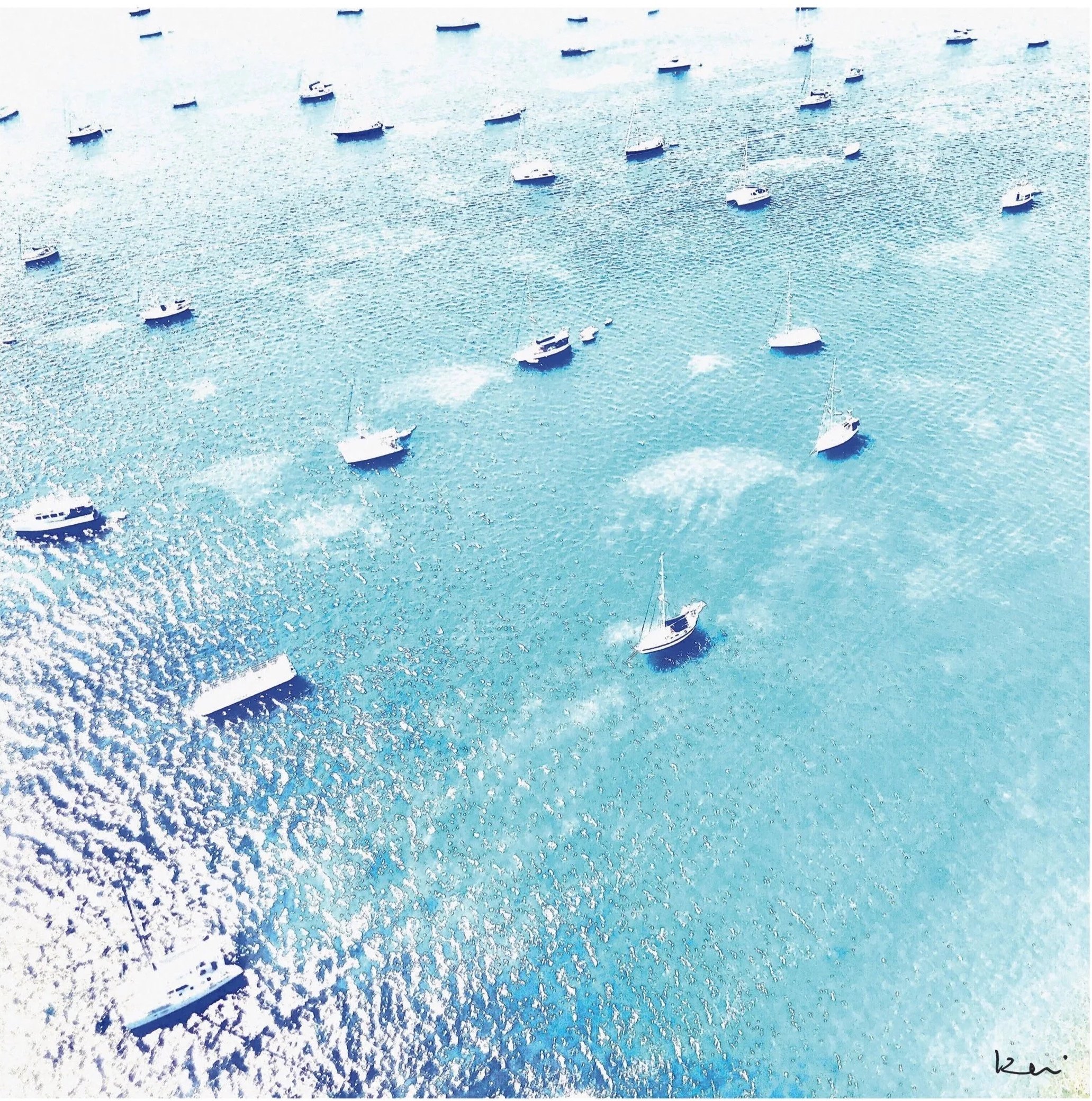  Captured mid-flight, this aerial glimpse of  Anguilla ’s cerulean seascape brings the Caribbean indoors.  