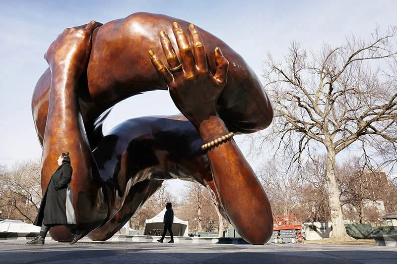 The MLK statue looks like…