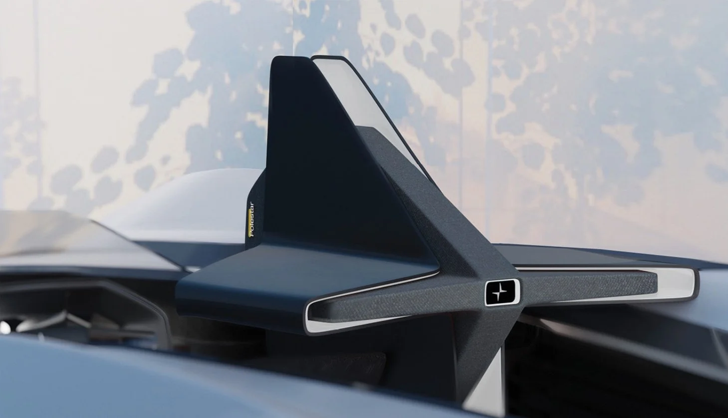 Close-up of a futuristic black and gray steering wheel with a digital display and sleek design.