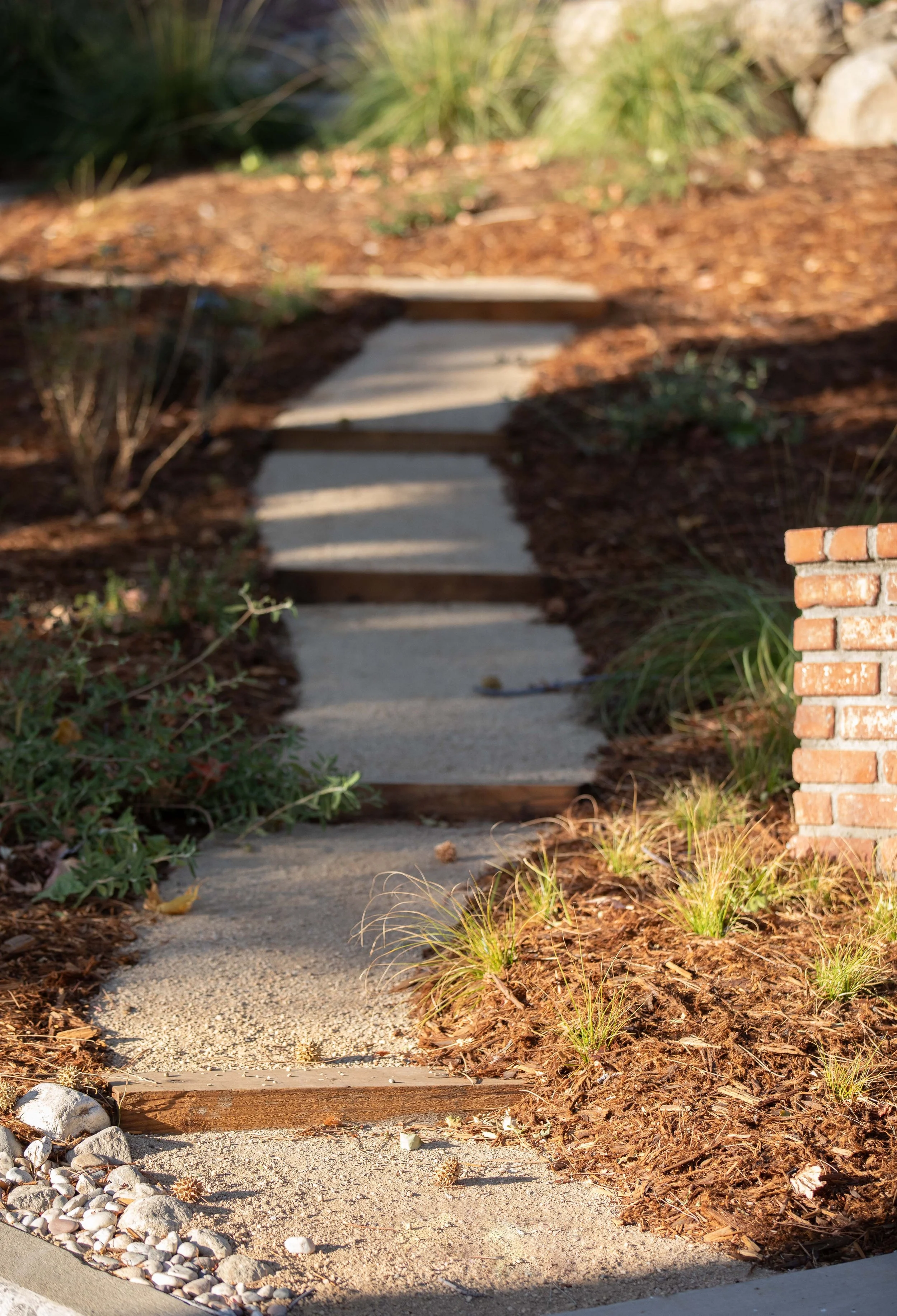 Decomposed granite path with flagstone steps and brick risers, residential garden La Cañada Flintridge