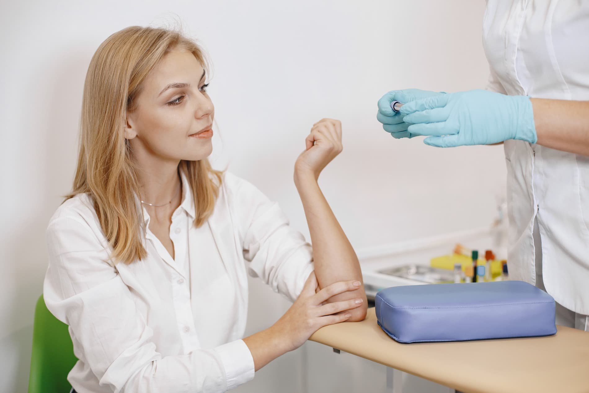 Patient having blood drawn at a clinic for lab work before starting a medical weight loss program.
