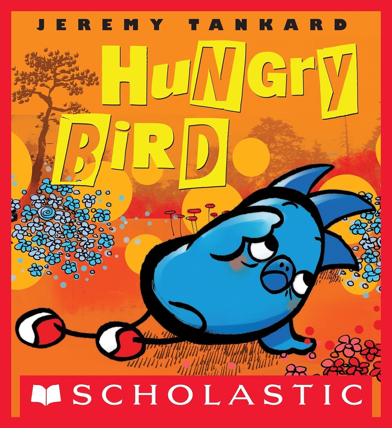 Portada del libro infantil 'Hungry Bird' de Jeremy Tankard, con un pájaro azul pequeño y caricaturesco que saluda con la mano, fondo en tonos anaranjados con árboles y círculos, y el logo de Scholastic en la parte inferior.