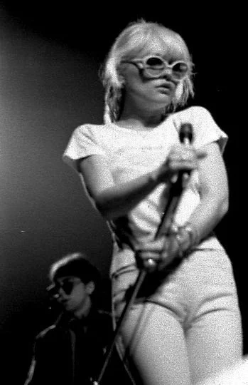 Debbie Harry lead singer of Blondie with microphone.