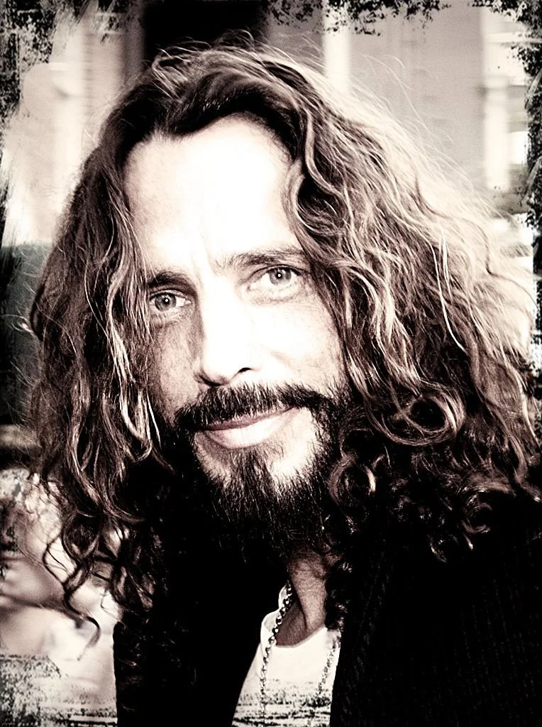 Portrait of the late Chris Cornell in black and white.