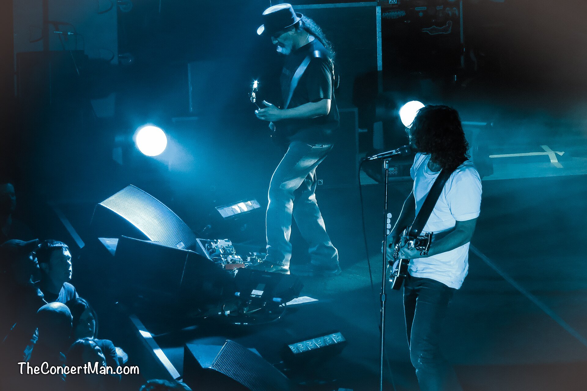 Chris Cornell and Kim Thayil on stage performing.