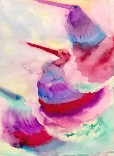 Watercolor painting of two hummingbirds with vibrant purple, pink, red, blue, and green colors. Part one of the Intuitive Art as Medicine eCourse.