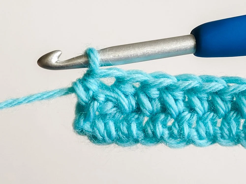 Last hdc of the row is worked into the top of the beginning chain-2.