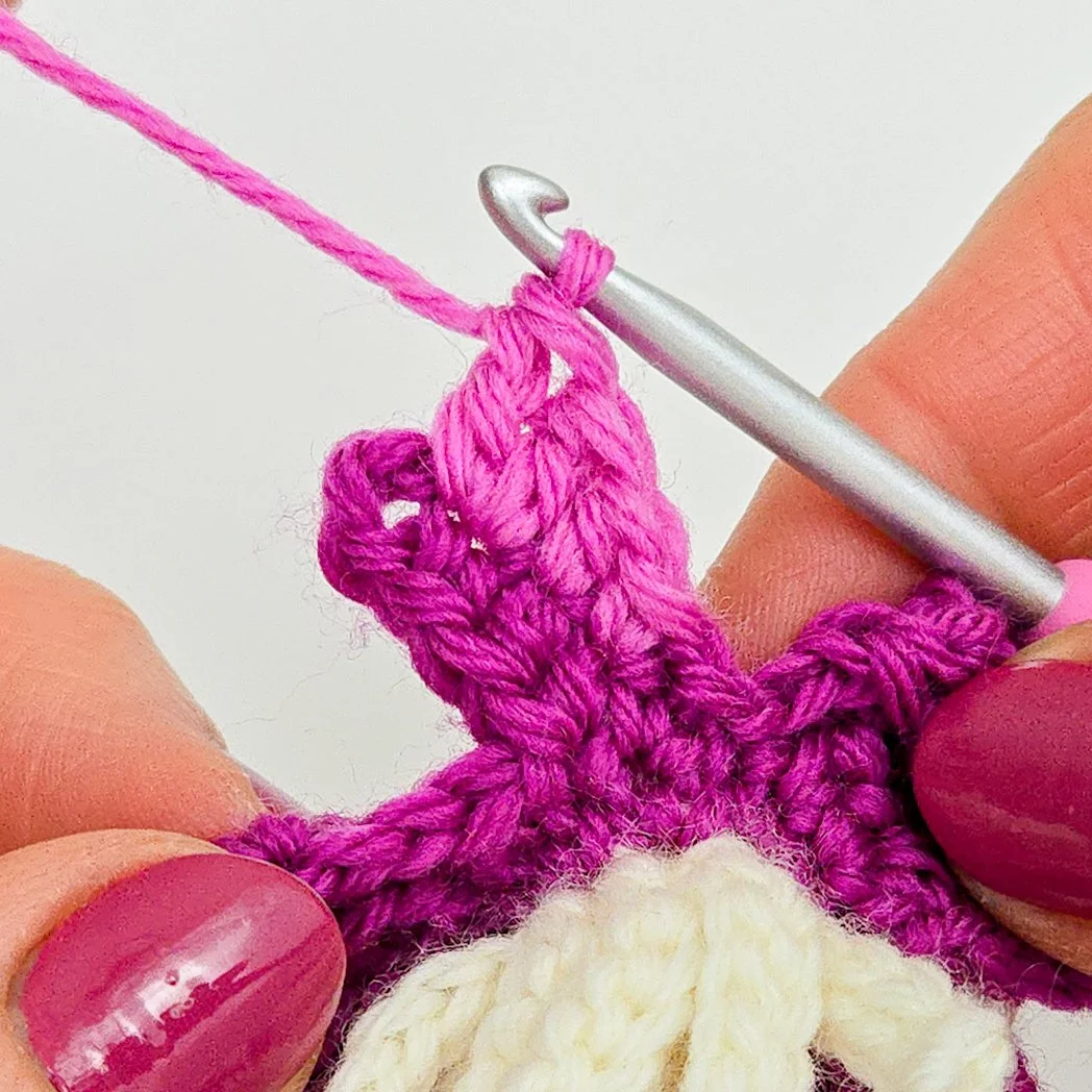 Working in free loops of chain going up the side of next petal center.