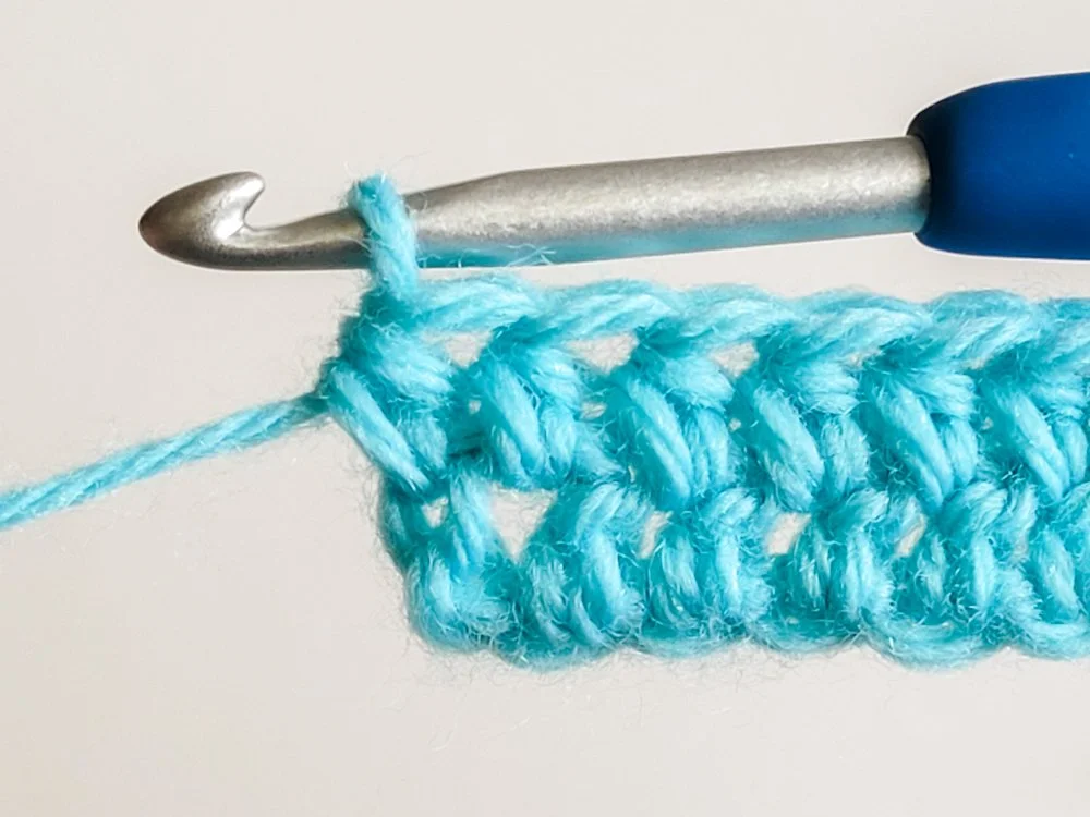 Last hdc of the row worked in the top of the beginning chain-2.