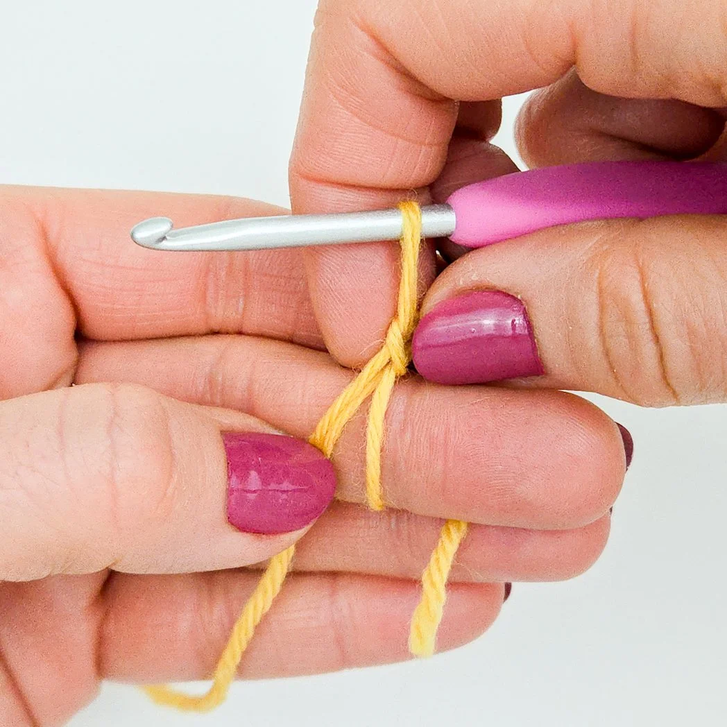 Closeup of fingers holding the chain so fingers of other hand can be removed easily.