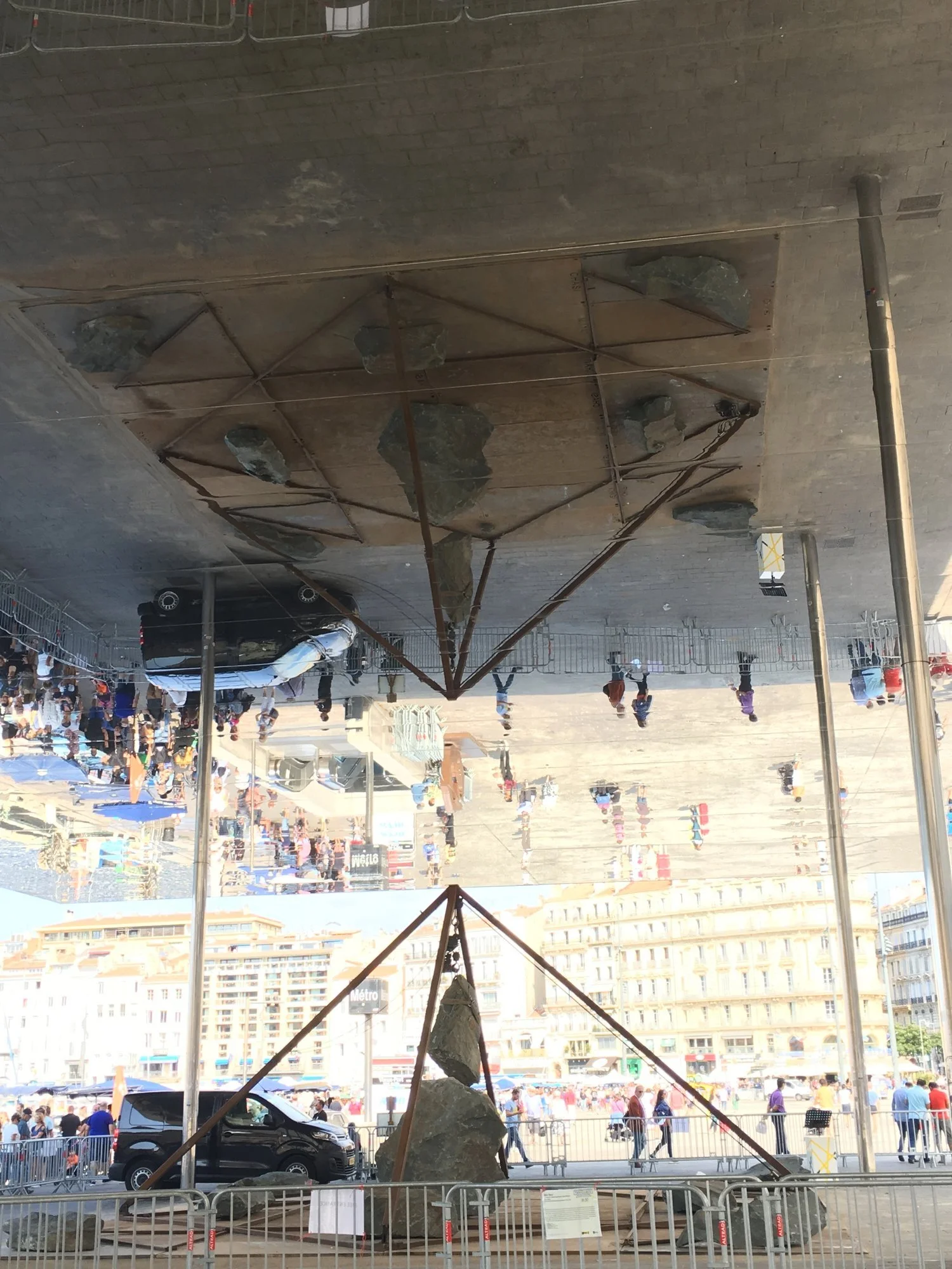  interesting art structure is a “mirror” on large pillars. It reflects the art work that is under it as well as all people viewing it.&nbsp; 