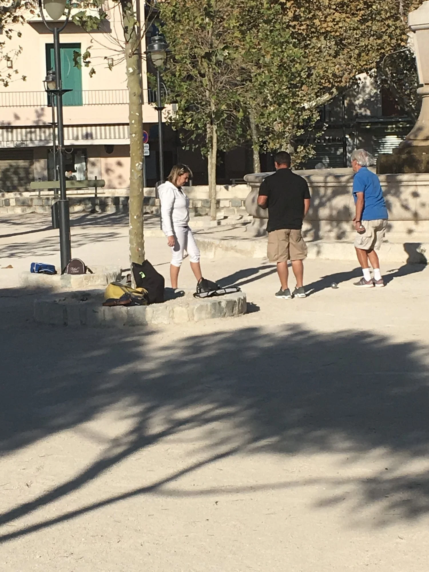  Even a very windy day does not keep many from playing some Bocce Ball on this sunny day.&nbsp; 