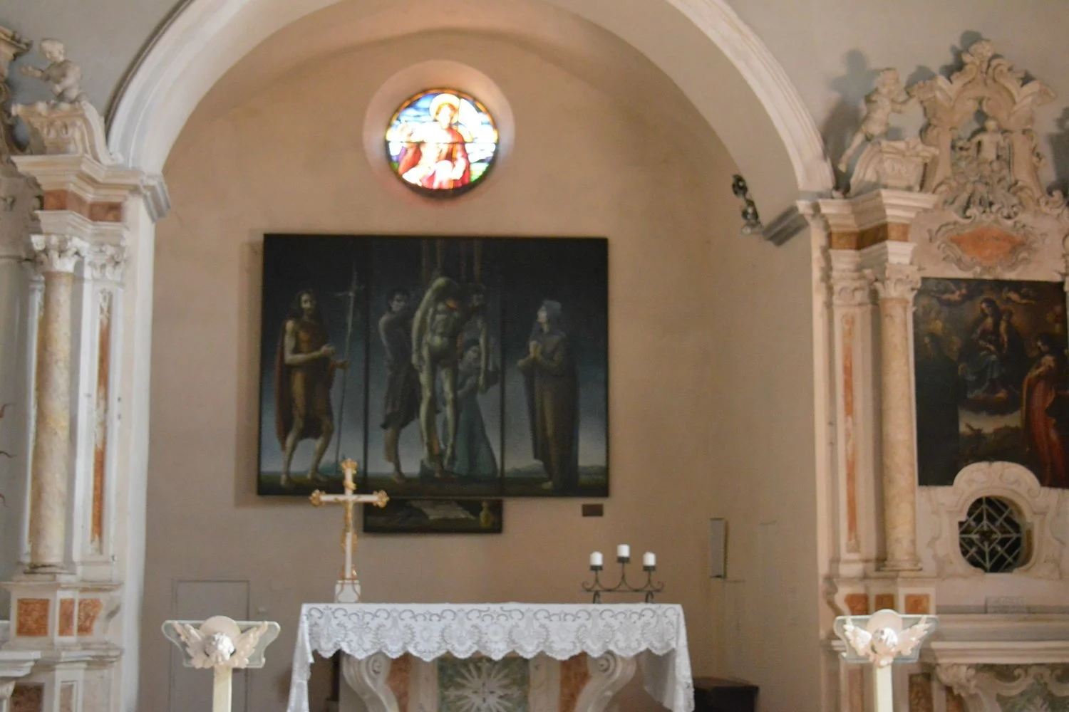  Alter and haunting painting of Christ being taken off the cross. 