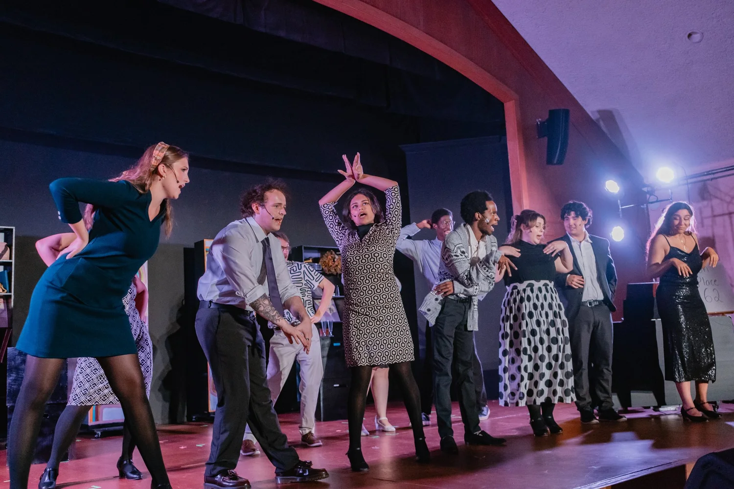 The company of Merrily We Roll Along on stage