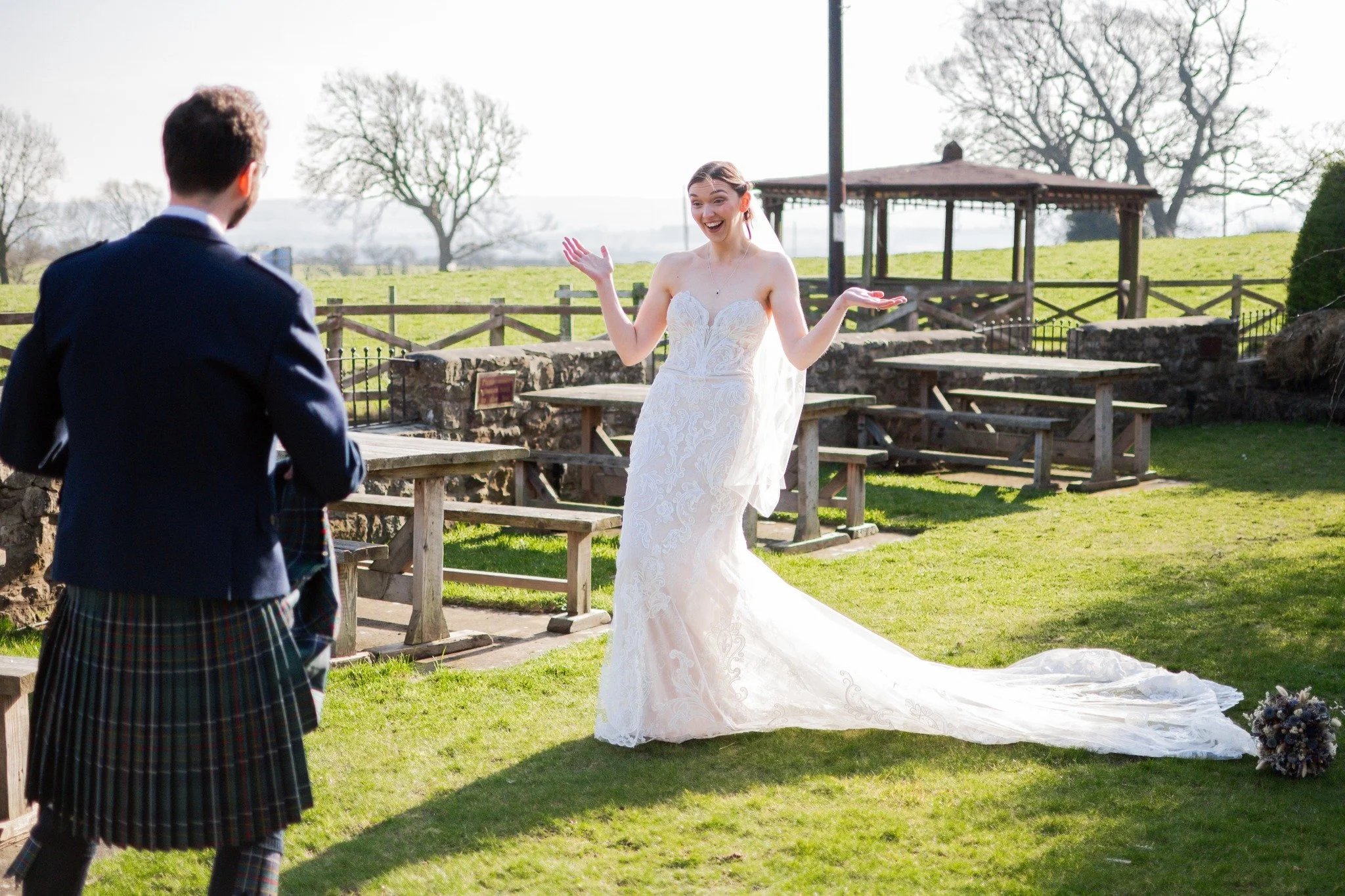 We love taking a silly wedding photo, as it's a time to celebrate and have fun. So, when a groom wears a kilt, we have to take advantage; so here's Dan, giving Vanessa a surprise!

Don't worry, he's not a 'true' Scotsman, all PG fun here 😂