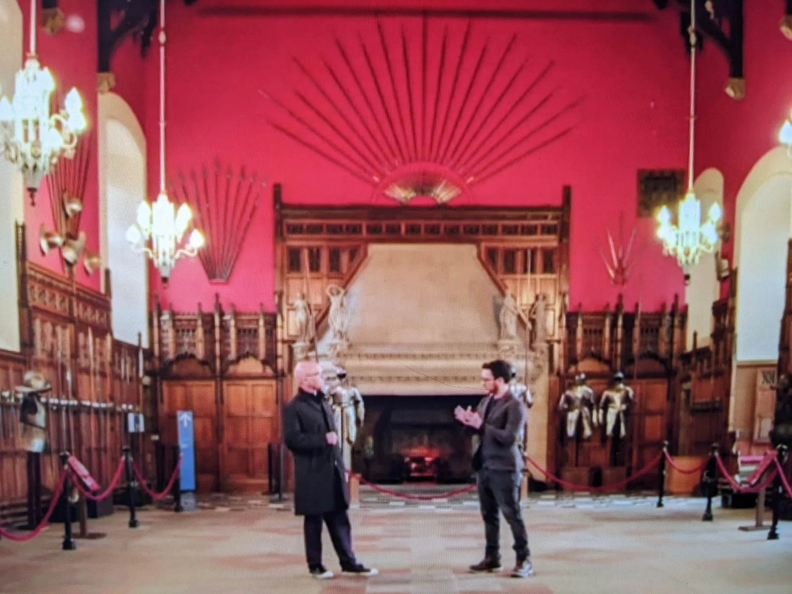 David and celebrity TV presenter Gregg Wallace stand inside the sumptuous Great Hall of Edinburgh Castle, backed by a huge fireplace and weapons and armour on the walls.