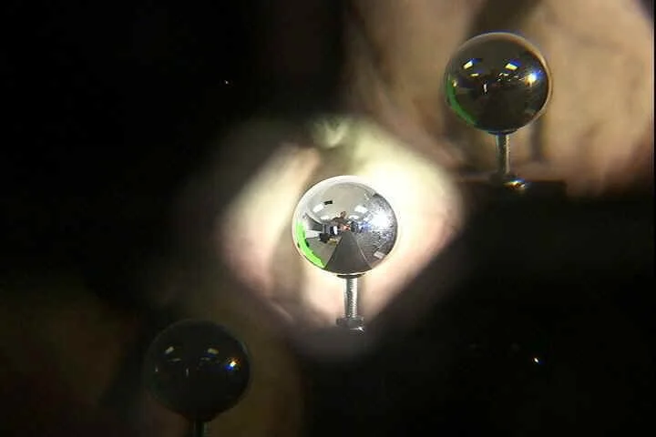 Five images of a mirrored ball, each with a different exposure