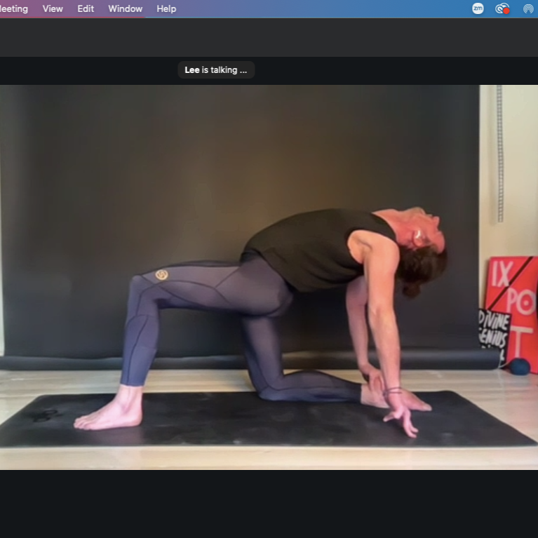 Online yoga class personalised home practice. Man doing half camel pose ardha ustrasana.