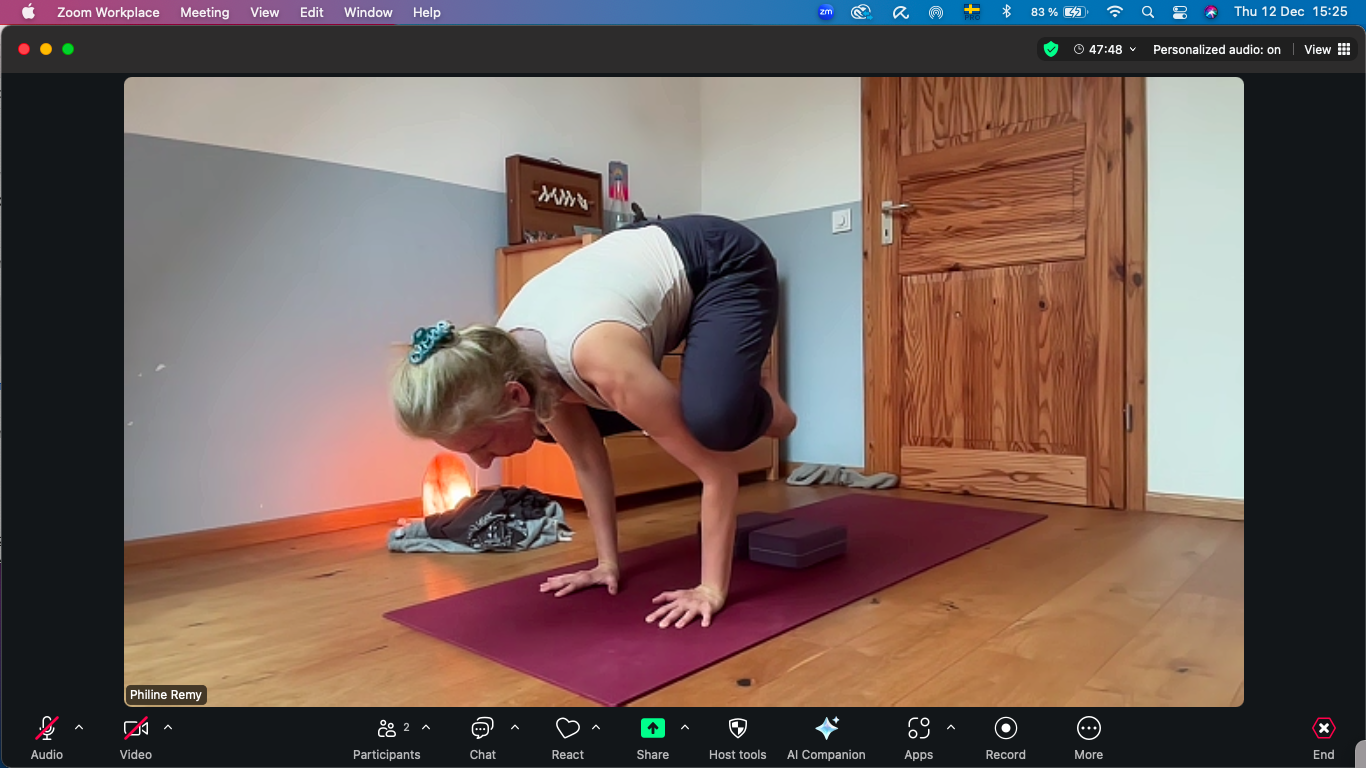 Online yoga class personalised home practice. Woman doing an armbalance pose bakasana.